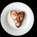heart-shaped toasted bread on round white ceramic plate