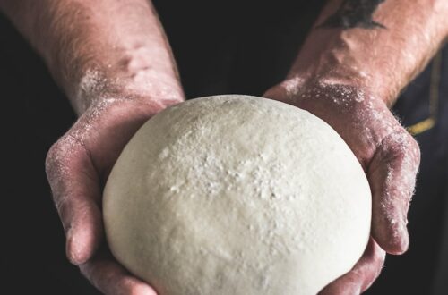 person holding dough