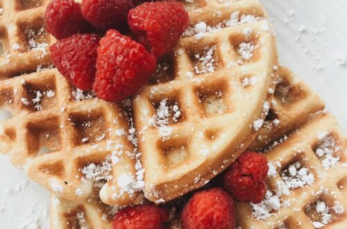 red strawberries on brown waffles